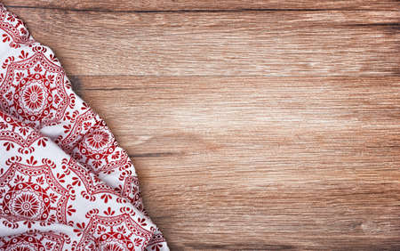 Christmas napkin on the wooden background.