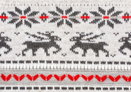 Christmas ornamental knitting with deers and snowflakesの写真素材
