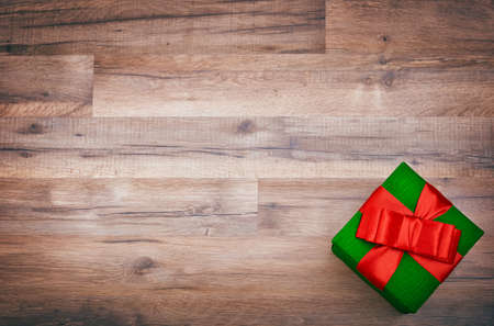 gift box on wooden table, christmas , birthday, mother's day or valentine backgroundの写真素材