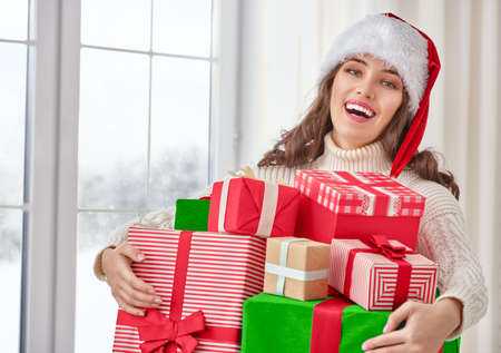 Beautiful young woman with gift boxesの写真素材