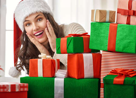 Beautiful young woman with gift boxesの写真素材