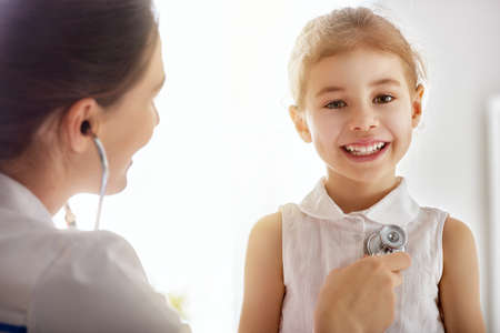 doctor examining a child girl in a hospital