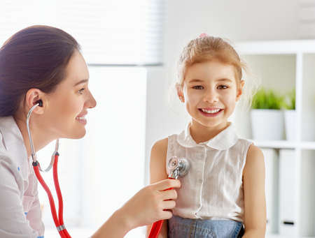 doctor examining a child girl in a hospital