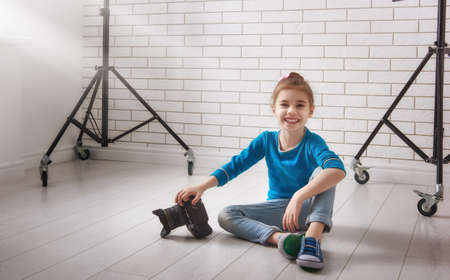 Cute little child girl in photo Studioの写真素材