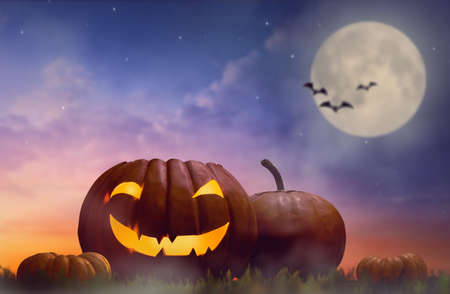 Happy halloween! Head pumpkin on sunset background.の写真素材