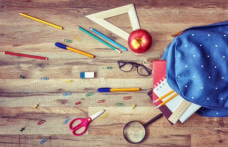 Back to school and happy time! Wooden desk with supplies. Top view.の写真素材
