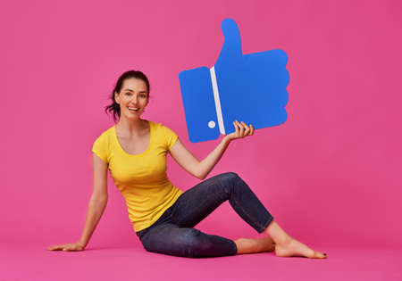 Beautiful young woman girl with cartoon like icon on colorful background. Yellow, pink and blue...