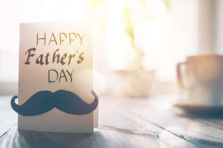 Happy father's day! Postcard on background of wooden table.の写真素材