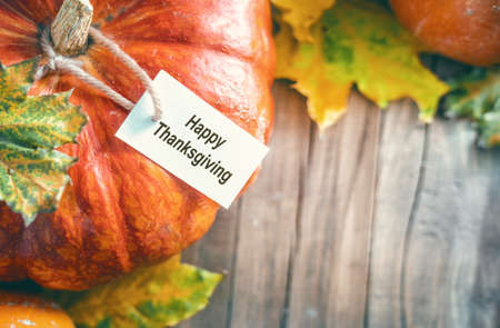 Happy Thanksgiving Day! Autumn feast. Celebrate holidays. Pumpkins on wooden table.の写真素材