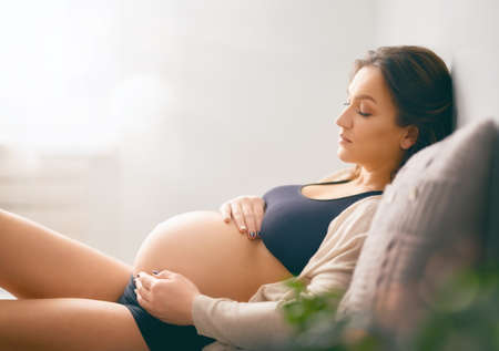 Portrait of the young pregnant woman