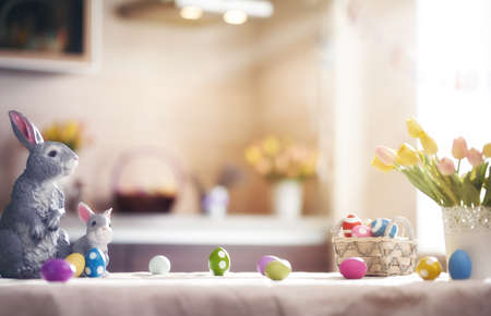 Happy Easter! Background with colorful eggs in basket. Table decorating for holiday.の写真素材