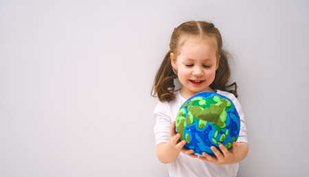 Child with globe. Happy Earth day.