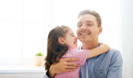Happy loving family. Daddy and his daughter child girl playing together. Father's day concept.の写真素材