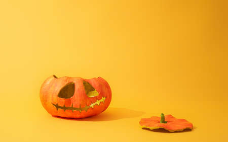 Happy halloween! Pumpkin lantern on yellow background.の写真素材
