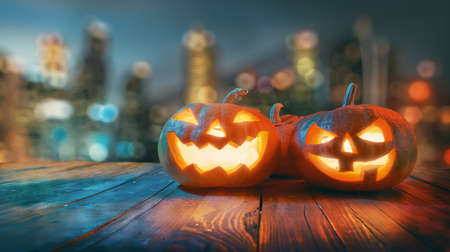 Happy Halloween! Pumpkins on wooden table on dark background.の写真素材