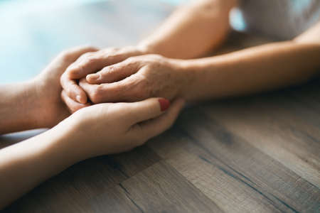 Hands in hands. Support for people who is ill.                               の写真素材