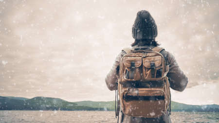 Happy young woman on a winter walk in nature.の写真素材