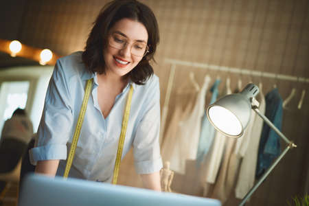 Woman is working at workshop. Concept of small business.