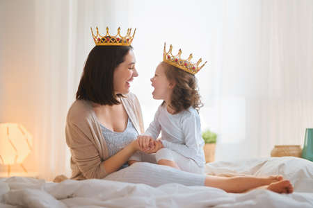 Happy loving family. Mother and her daughter child girl playing and hugging at home.の写真素材