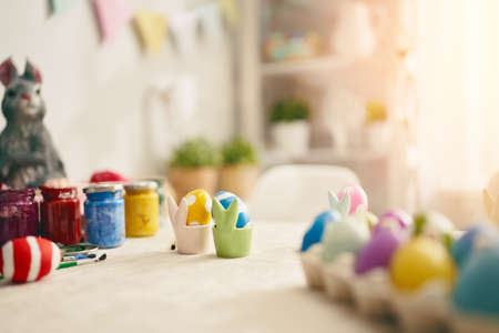 Happy Easter! Background with colorful eggs in basket. Table decorating for holiday.の写真素材