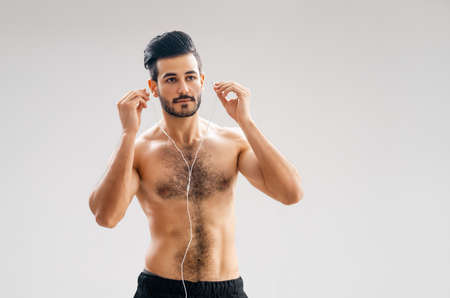 Healthy lifestyle and sport concepts. Man is doing exercise. Person is listening music.の写真素材