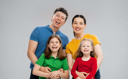 Happy loving family. Mother, father and children daughters on white background. の写真素材