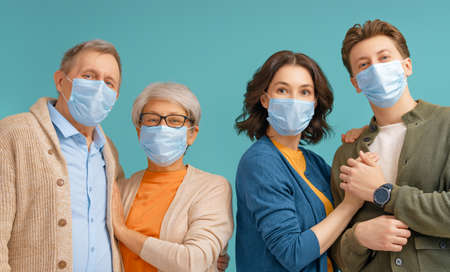 Family is wearing facemasks during coronavirus and flu outbreak. Virus and illness protection,...