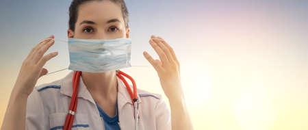 Doctor wearing facemask during coronavirus and flu outbreak. Virus and illness protection, home...