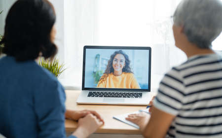 Women are using laptop pc for remote conversation. People having fun staying at home.