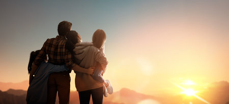 Happy family at sunset. Father, mother and children are having fun and enjoying journey. The kid...