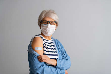 Senior woman after vaccination. Virus protection.