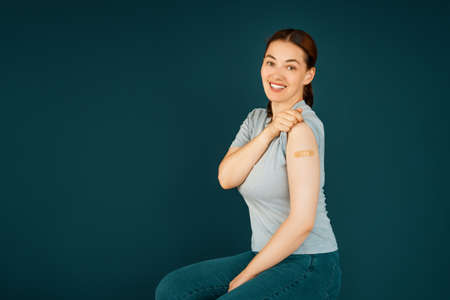 Young woman after vaccination. Virus protection.の写真素材