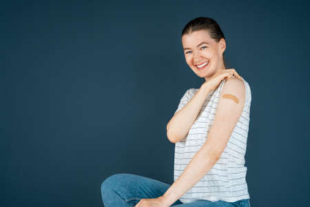 Young woman after vaccination. Virus protection. COVID-2019.の写真素材