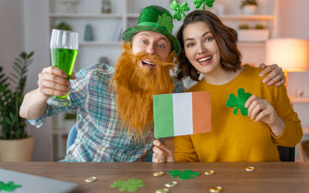 Happy family couple celebrating St. Patrick's Day.の写真素材