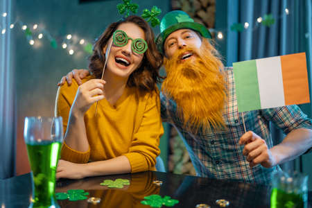 Happy family couple celebrating St. Patrick's Day.