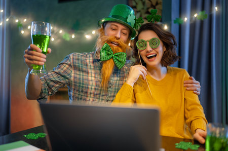 Happy family couple celebrating St. Patrick's Day.の写真素材