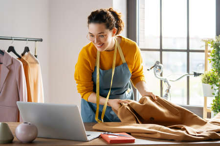 Woman is working at workshop. Concept of small business.