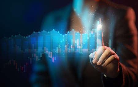 Office woman is touching finger virtual screen with stock market changes, business chart.