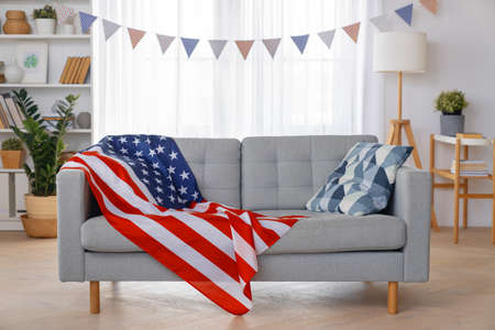 Patriotic holiday. The USA are celebrating 4th of July. American flag in the room.の写真素材