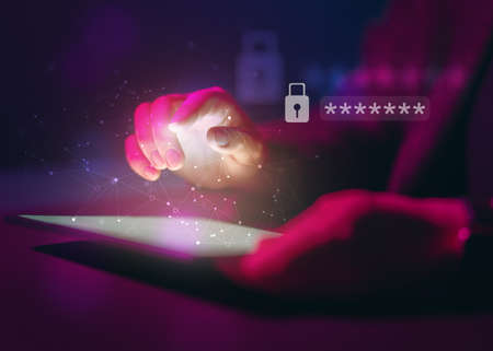 Lock the tablet pc with a password for cybersecurity or a password to confirm login in the online banking application. Cyber security threats.の写真素材