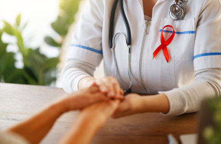 Pink ribbon for breast cancer awareness. Female patient listening to doctor in medical office....