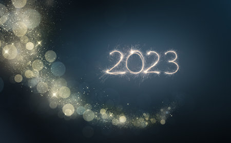 2023 New Year festive fireworks lights on dark background.