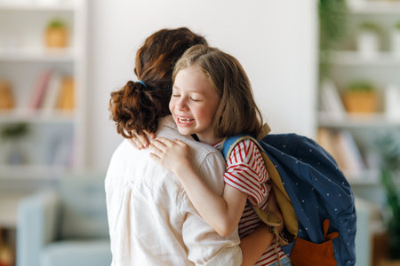 Happy family preparing for school. Little girl with mother.の写真素材
