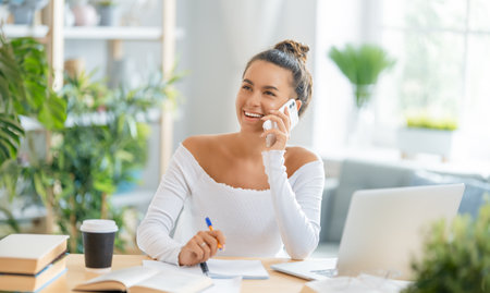 Happy casual beautiful woman working in home office.の写真素材