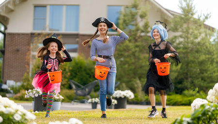 Happy kids at Halloween party. Children are wearing carnival costumes.の写真素材