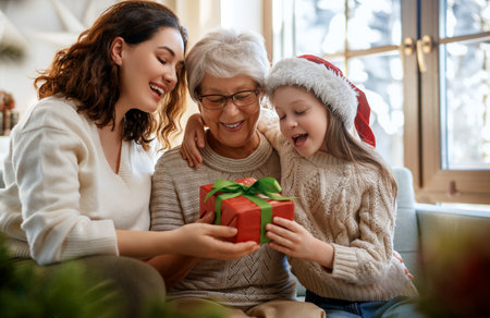 Merry Christmas and Happy Holidays. Cheerful kid presenting gifts to mom and granny. Parents and...