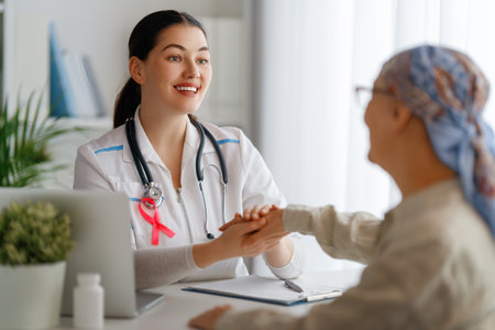 Colour ribbon for concept of illness awareness. Female patient listening to doctor in medical office. Raising knowledge on people living with disease.の写真素材