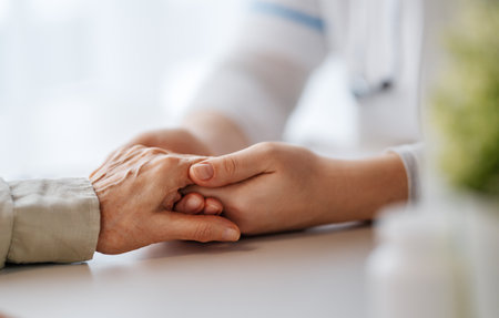 Female patient with doctor in medical office. Support of people living with tumor illness.の写真素材