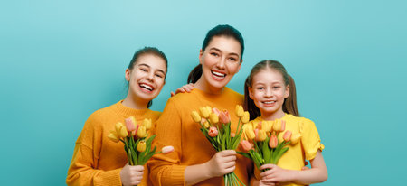 Happy day. Children daughters are congratulating mother. Family holiday and togetherness. Concept of International Women's Day.の写真素材