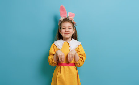 Cute little child wearing bunny ears on Easter day.の写真素材